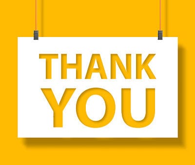 Thank you message on paper hanging with rope on yellow background